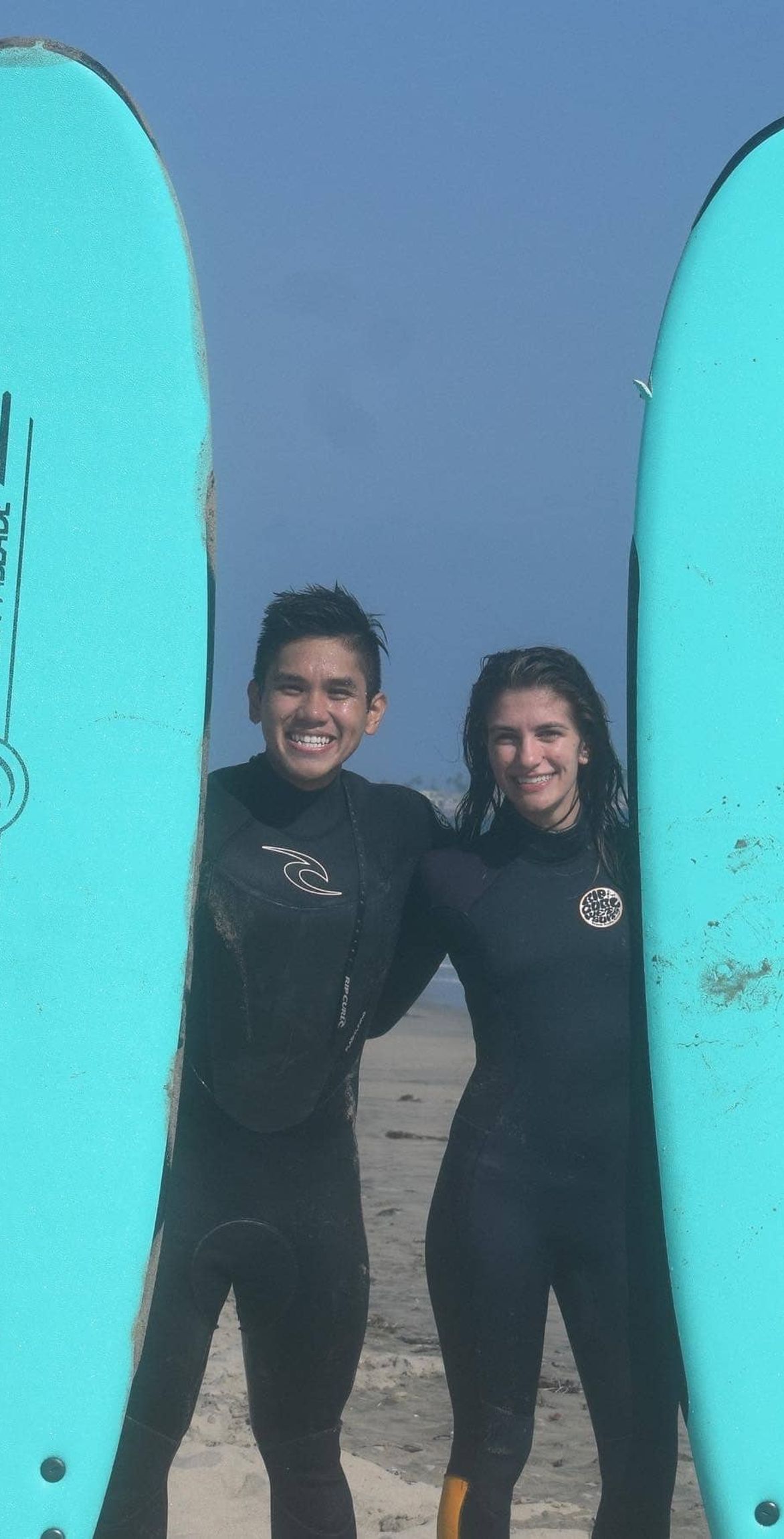 surfing instructor teaches youth